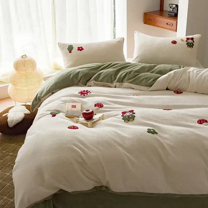Cream embroidered milk fleece bedding set with plush duvet in cream featuring red mushrooms and green forest creatures