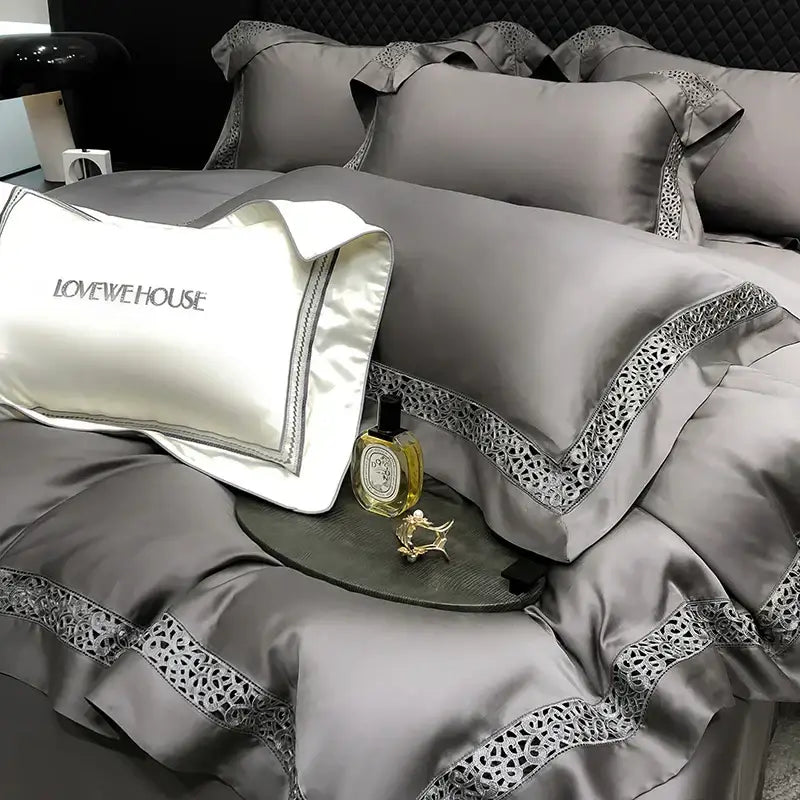Gray satin bedding set with intricate black lace trim and white lovewehouse pillow in decorbites eucalyptus lyocell 1000tc