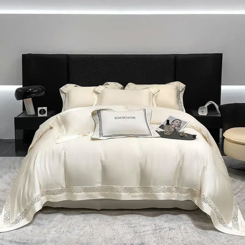 Cream-colored satin bedding set with lace trim and black embroidered piping in decorbites eucalyptus lyocell 1000tc
