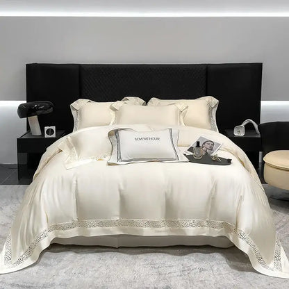 Cream-colored satin bedding set with lace trim and black embroidered piping in decorbites eucalyptus lyocell 1000tc