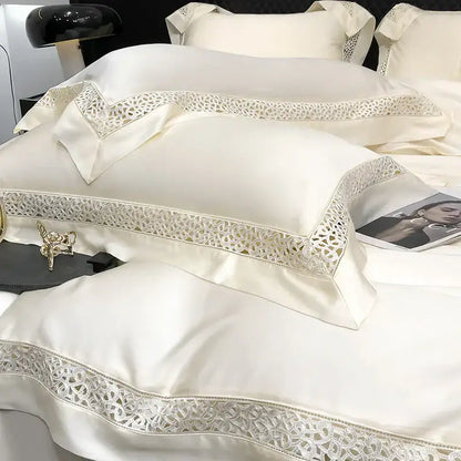 Cream-colored satin pillowcases with delicate silver lace trim in a decorbites eucalyptus lyocell 1000tc bedding set