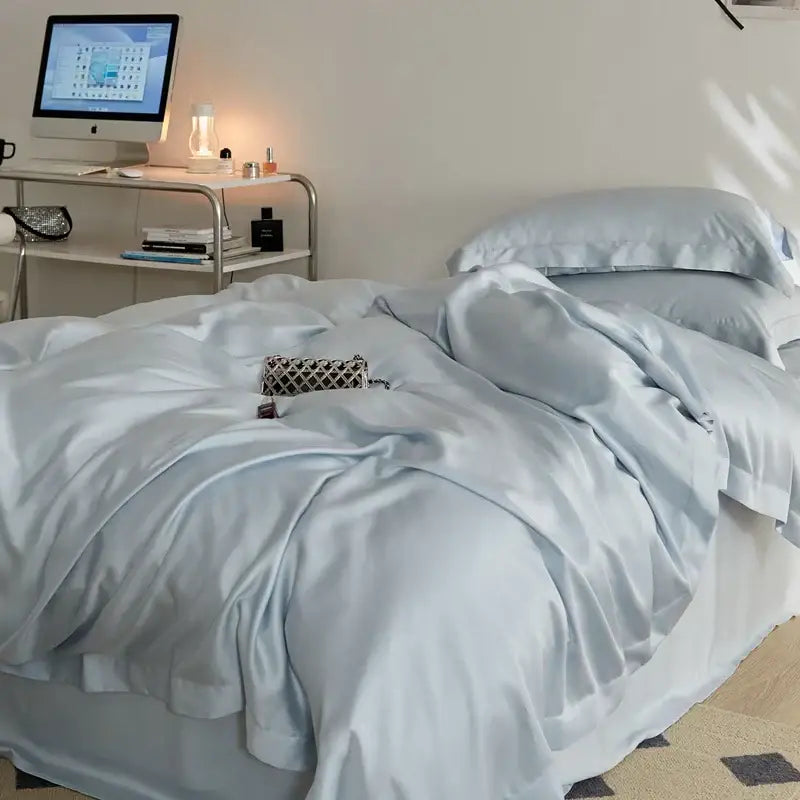 Light blue satin bedding set with subtle sheen and ruffled edges from decorbites eucalyptus lyocell luxury collection