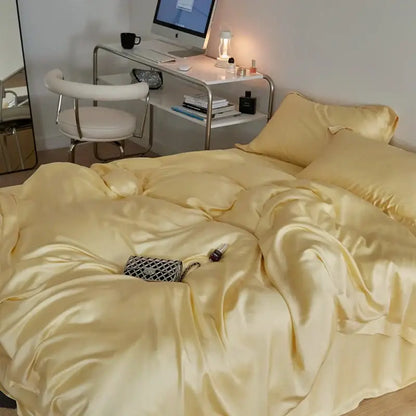 A pale yellow satin cream eucalyptus lyocell luxury bedding set with a smooth glossy finish and matching pillowcases