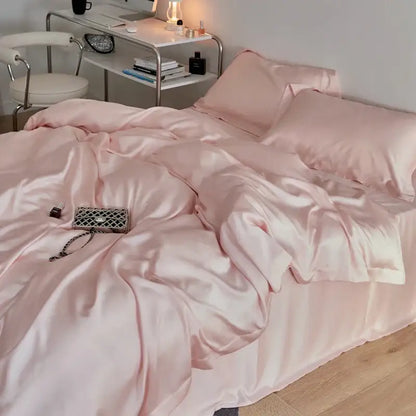 A sleek metallic silver chanel handbag on cream eucalyptus lyocell luxury bedding set by decorbites