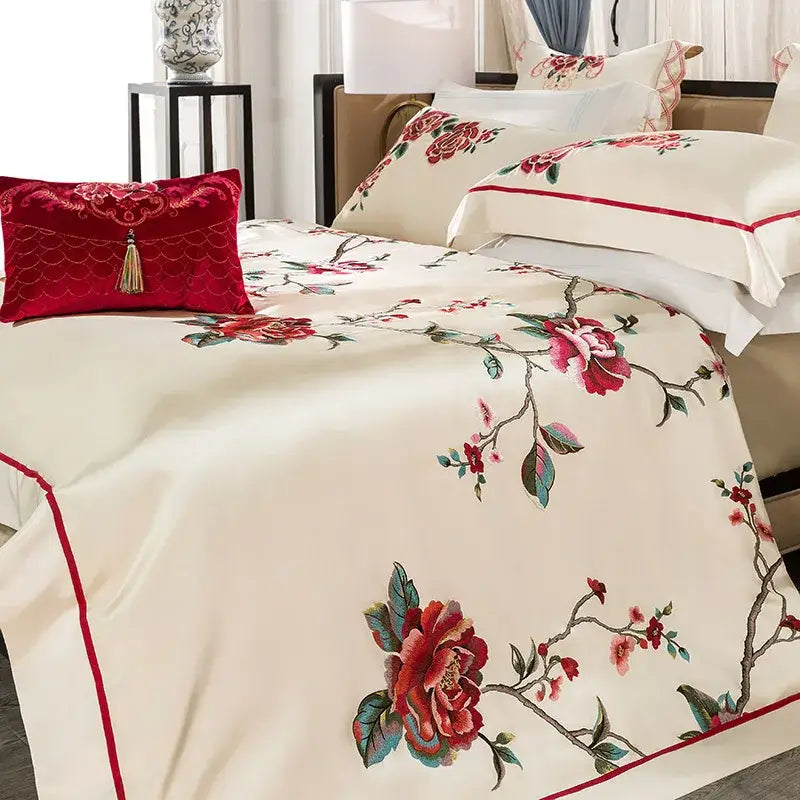 Cream floral 200s embroidery egyptian cotton bedding set with cream satin bedspread, red and green floral embroidery, and red border