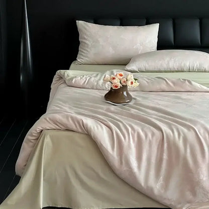 A cream floral cotton jacquard bedding set with peach and white roses in a matte brown ceramic vase on the bed