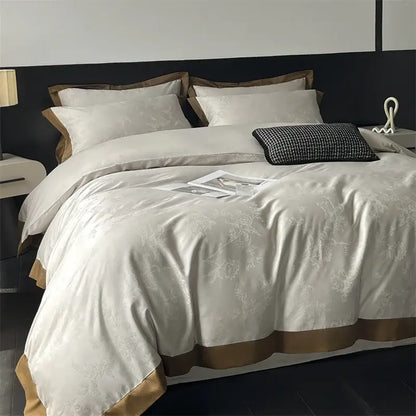 Cream floral jacquard bedding set featuring cream-colored satin duvet cover with subtle embroidery and gold-toned trim
