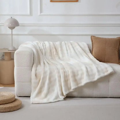 Cream fuzzy faux fur blanket draped over sofa enhancing bedroom and living room decorbites fuzzy faux throw
