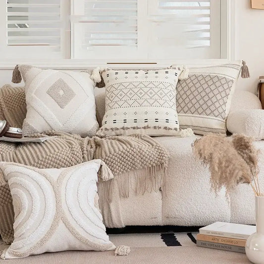 Cream pillow cover with geometric embroidered crocheted design and tassel accents for living room decorbites decor