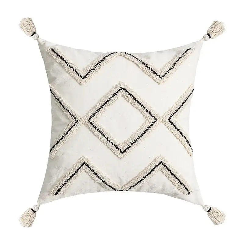 Cream cushion cover with geometric embroidery and tassels featuring decorbites geometric embroidery design for living room decor
