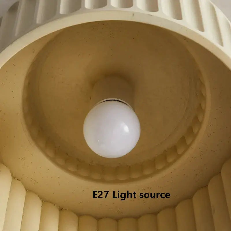 Cream green led chandelier lamp with cream-colored ribbed lampshade and white spherical bulb for dining room lighting