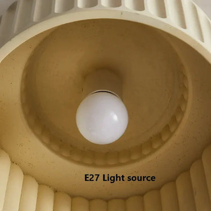 Cream green led chandelier lamp with cream-colored ribbed lampshade and white spherical bulb for dining room lighting