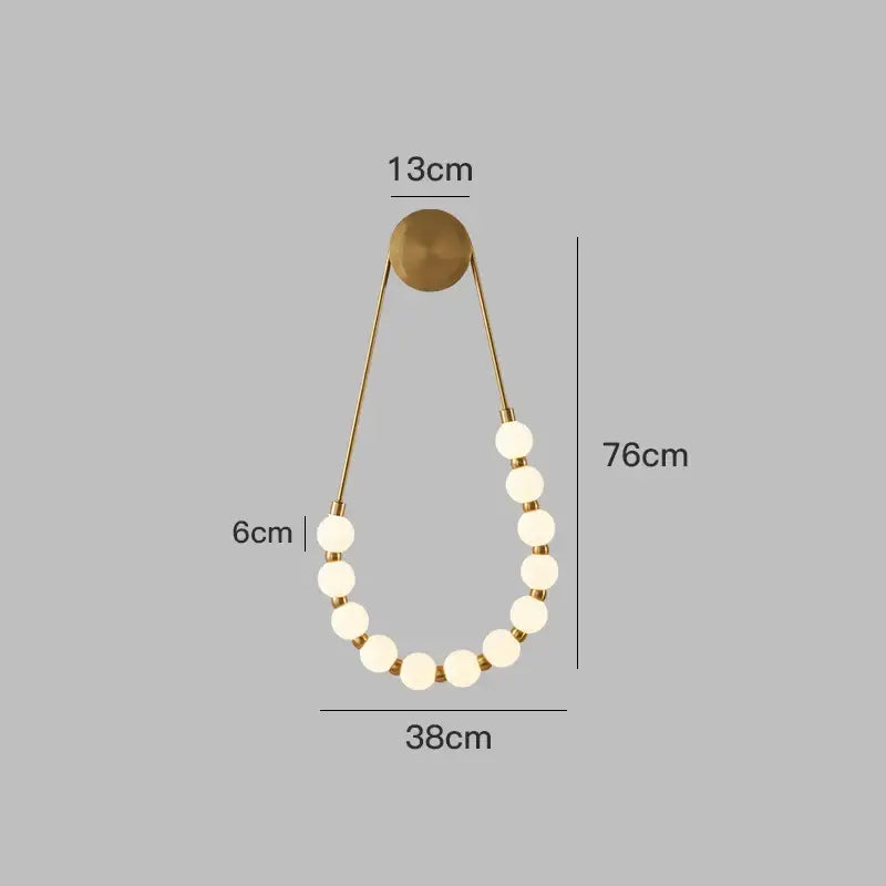 Cream italian style wall lamp with gold-toned pendant, circular mount, and frosted glass bead accents for bedroom decorbites cream italian