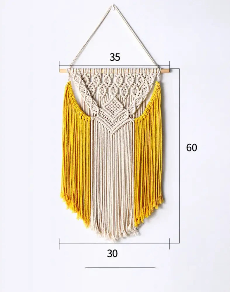 Beige and mustard yellow cotton macrame wall hanging with intricate knotwork and fringe for living room decorbites decor