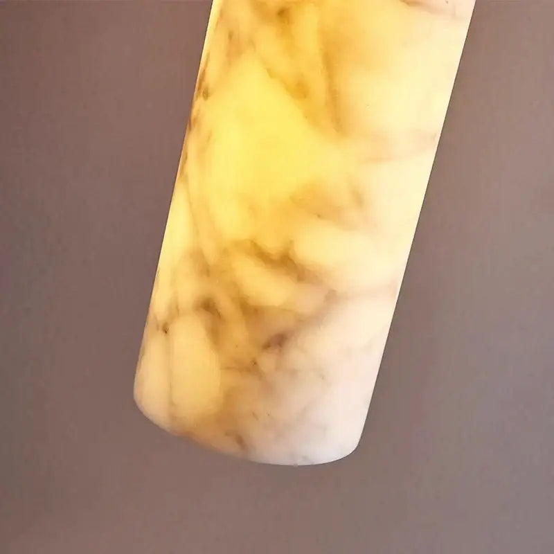 Cream marble cylinder pendant light with creamy white and golden-yellow veining for luxury bedroom and bar counter decorbites cream marble