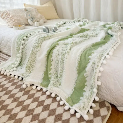 Soft mint-green and white striped plush throw blanket with fluffy ball lace trim from decorbites jacquard fluffy collection