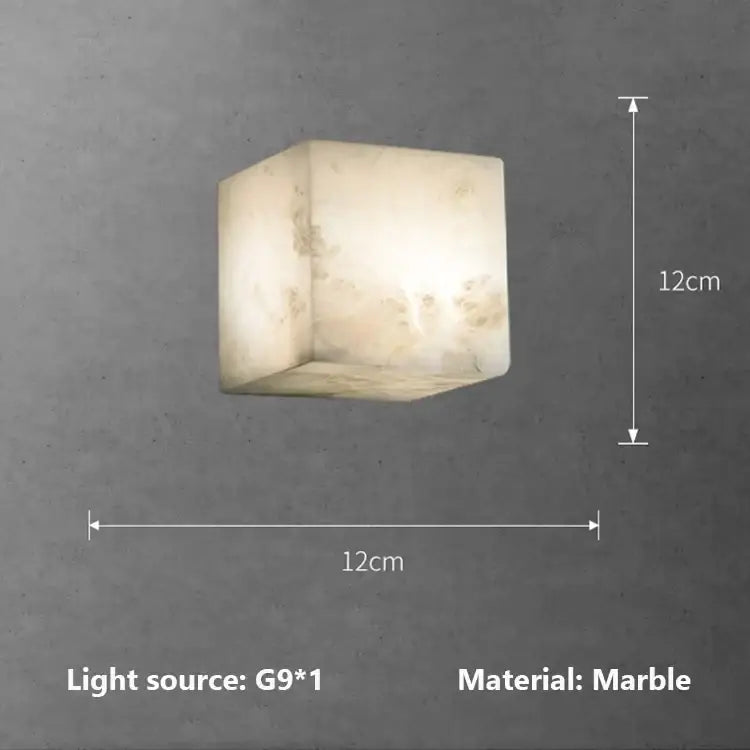 Cream onyx marble cube led wall sconce with soft warm glow for bedroom lighting and modern wall illumination