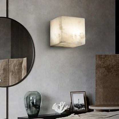 Cream onyx marble cube led wall sconce with softly glowing translucent alabaster finish for bedroom lighting