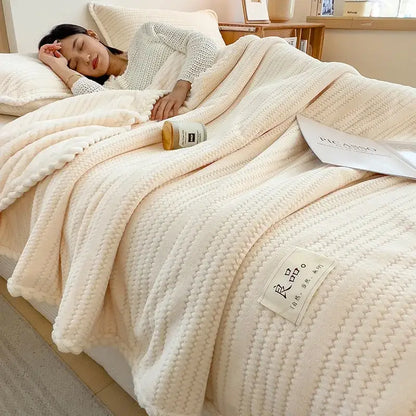 Cream plush double sided jacquard milk velvet blanket featuring a textured ribbed knit pattern and soft cozy appearance