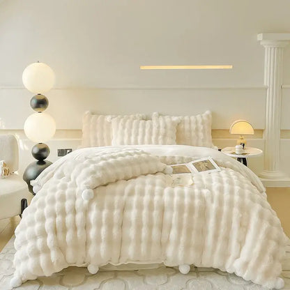Cream plush rabbit fur bedding set with quilted texture and fluffy pom-pom trim luxury fur bedding set