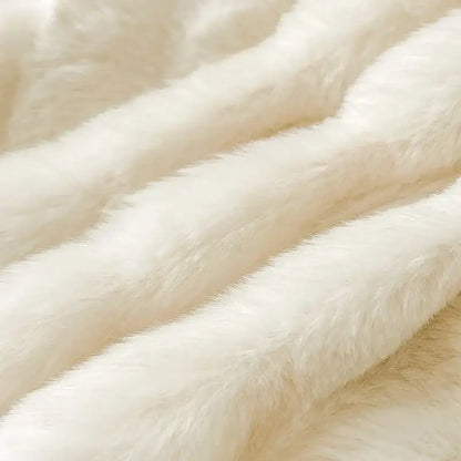 Cream plush rabbit fur bedding set featuring a cream-colored faux fur blanket with plush soft texture and gentle waves