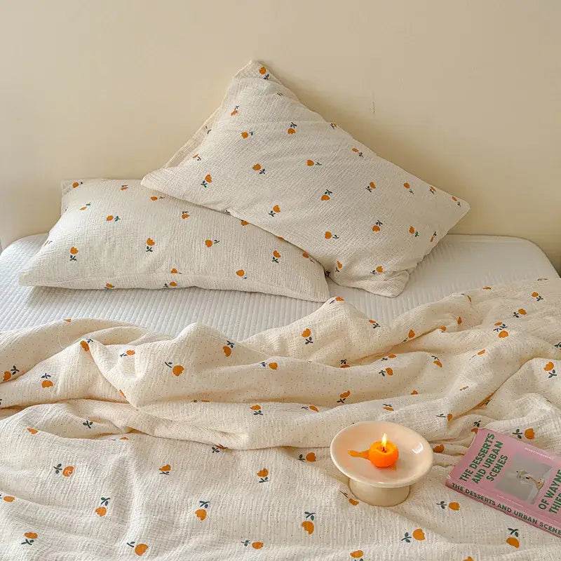 Cream polka dot floral quilt set featuring cream-colored cotton bedding with delicate orange fruit motifs