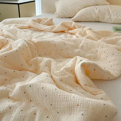 Cream muslin quilt set with multicolored polka dot floral pattern for bedroom bedding