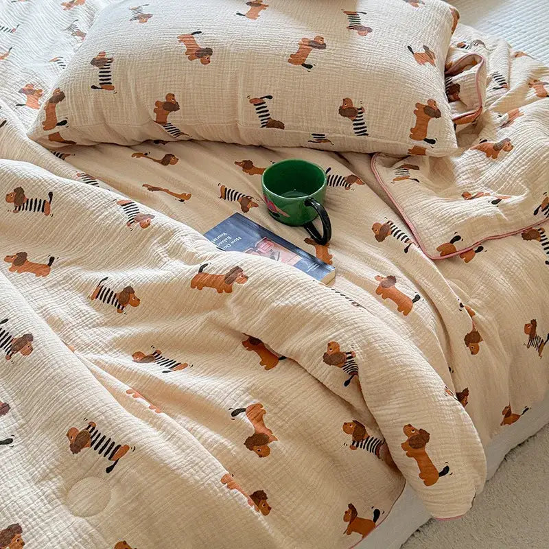 Cream polka dot floral quilt set featuring a cream muslin quilt with playful brown dachshunds in black-and-white stripes