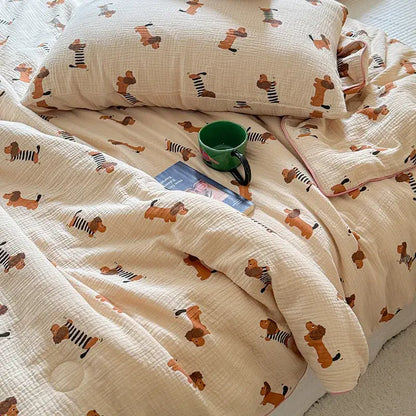 Cream polka dot floral quilt set featuring a cream muslin quilt with playful brown dachshunds in black-and-white stripes