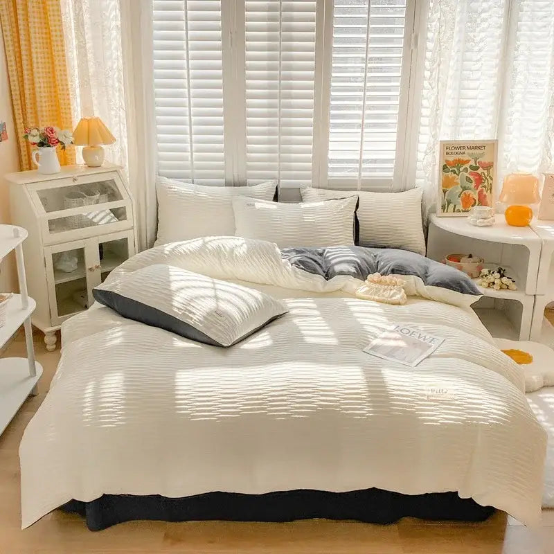Cream ribbed bubble yarn duvet cover set in cream with textured pattern and dark gray accent pillows for bedroom bedding