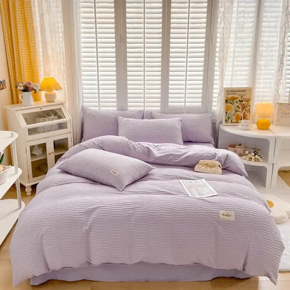 Lavender-striped cotton duvet cover set with soft textured finish and subtle ribbed detailing for bedroom bedding