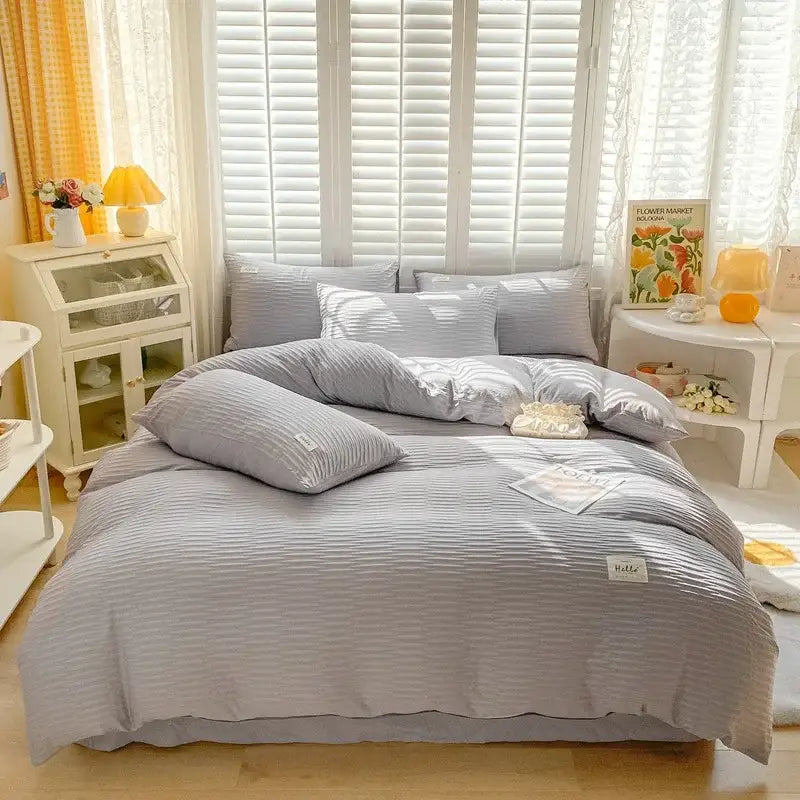 Light gray ribbed cotton duvet set with matching pillows and white label in cream decorbites bubble yarn fabric bedding set