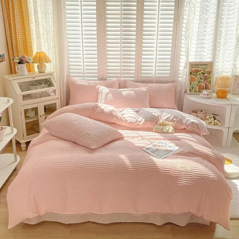 Pink ribbed cotton duvet bedding set with ruffled edge made from decorbites bubble yarn fabric for bedroom use