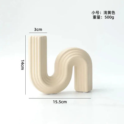 Cream ribbed geometric ceramic vase in s shape with vertical ridges from decorbites geometric for living room decor