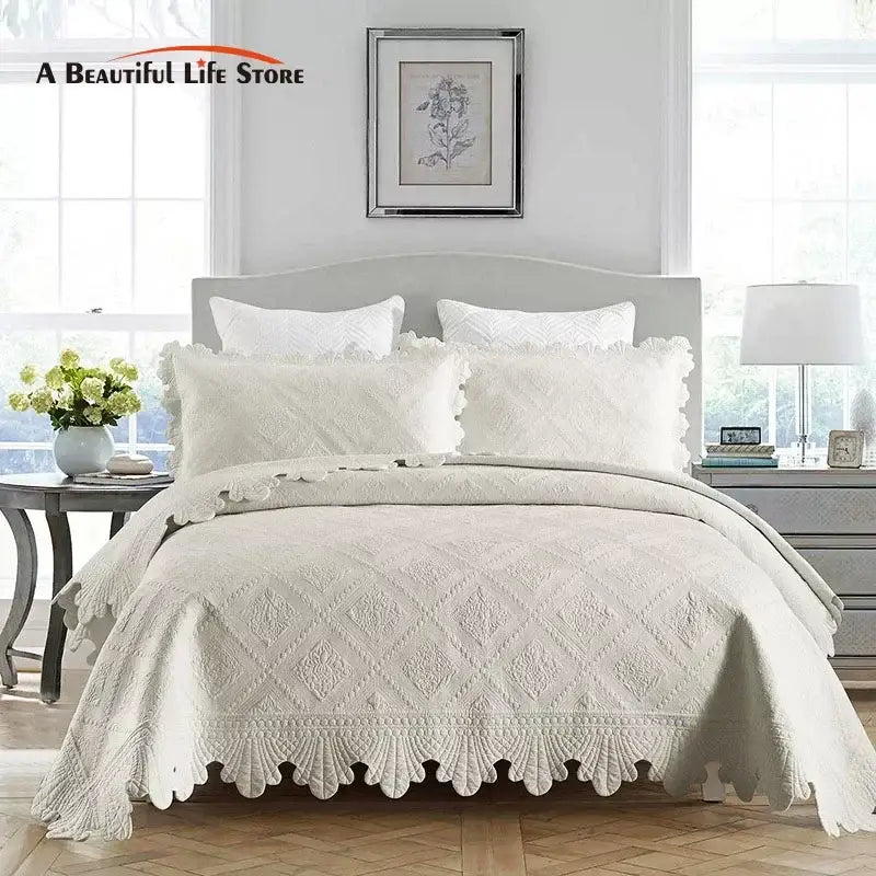Cream scalloped diamond cotton embroidery quilt set featuring a quilted bedspread with scalloped edges
