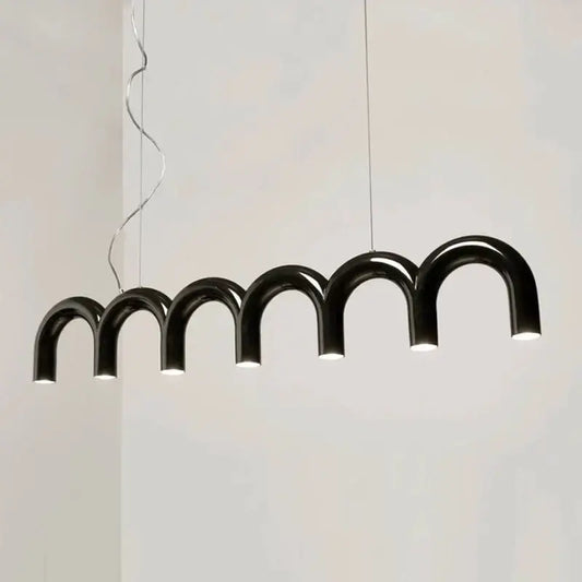Black arched pendant light with warm led illumination in cream style nordic design for living room decorbites cream style