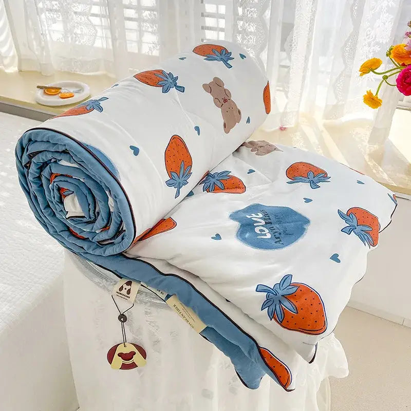 Cream teddy bear double layered soya fibre quilt with playful strawberry and bear pattern and soft blue trim