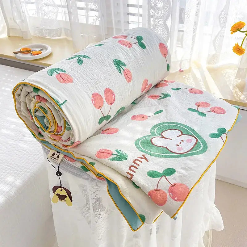 Cream teddy bear double layered soya fibre quilt in white with cherry and bunny pattern and yellow piping edges