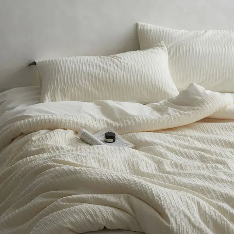 Cream textured cotton foam yarn bedding set with subtle ribbed pattern for comfortable bedroom use