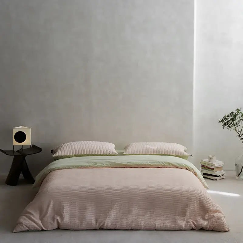 Soft blush pink ribbed duvet cover bedding set with green accent stripe made from cotton foam yarn foam yarn bedding