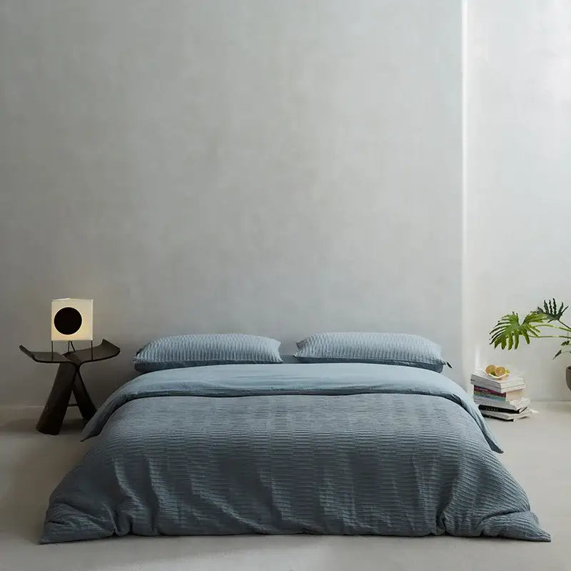 A soft blue ribbed duvet bedding set made from textured cotton foam yarn for a comfortable bedroom foam yarn bedding