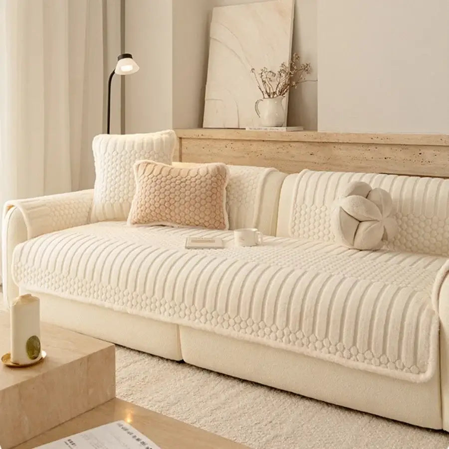 Cream jacquard knit sofa cover with plush texture and vertical ribbed diamond-patterned stitching for living room use