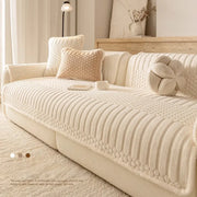 Cream textured jacquard knit sofa cover in plush loop yarn with ribbed pattern for cozy living room use