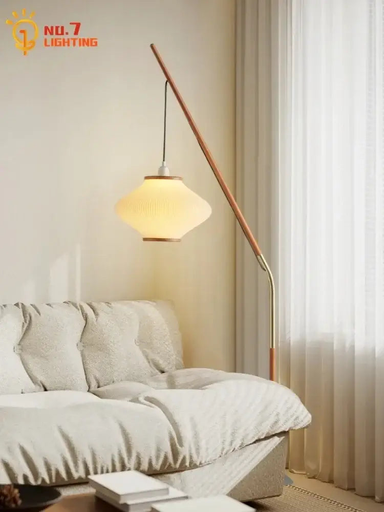 Cream wind acrylic amber glass floor lamp with curved wooden and brass stand and illuminated ribbed off-white shade for living room decorbites cream wind floor lamp