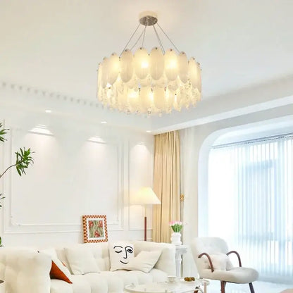 A cream wind led chandelier with tiered white opal glass shades in concentric circles for modern bedroom decorbites cream wind