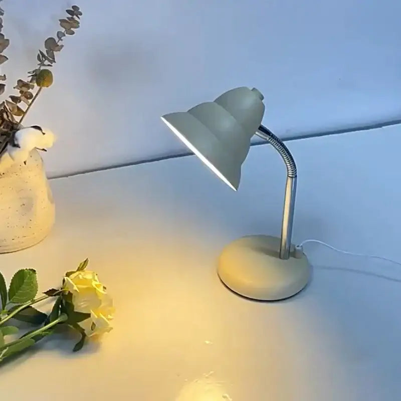 A sleek matte cream decorbites creamy style desk lamp with flexible gooseneck and soft white light for reading