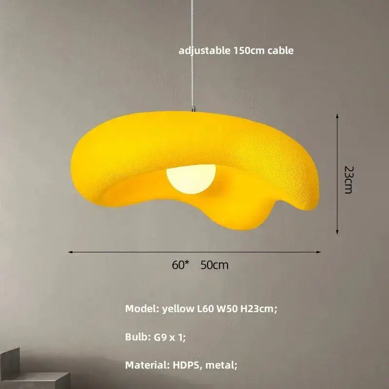 A vibrant yellow creamy style resin pendant light with smooth hdps and metal finish for dining room and kitchen island