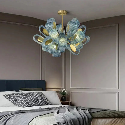 Creative blue glass luxury pendant light with gold accents and modern sculptural design for bedroom decorbites decor