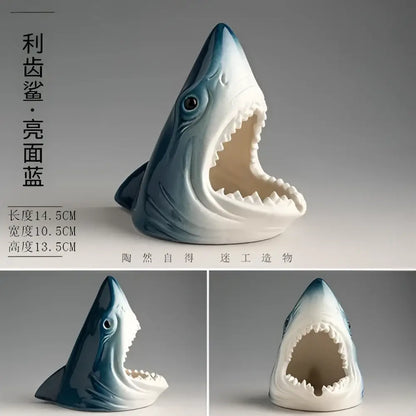 A glossy blue and white ceramic creative shark storage ashtray with wide-open mouth for living room decorbites decor