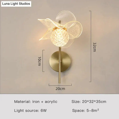 Creative floral decorative gold led wall lamp featuring spherical faceted crystal globe and sheer mesh petals for bedroom